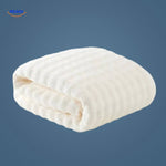 White waffle-textured bath towel with premium quick-dry fabric.