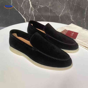 Black suede Beckwin loafers slip-on with white sole.