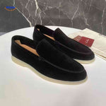 Black suede Beckwin loafers slip-on with white sole.