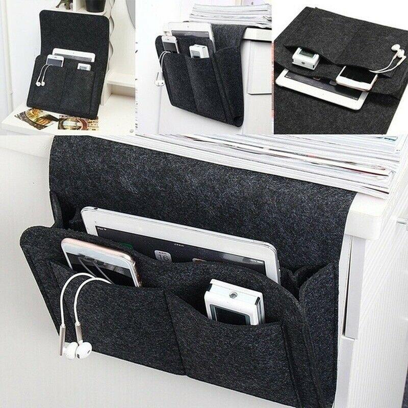 BedCaddy keeping essential items accessible by the bed in black felt.