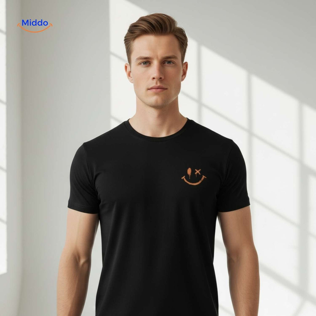Close-up of smiley print on black breathable cotton t-shirt.