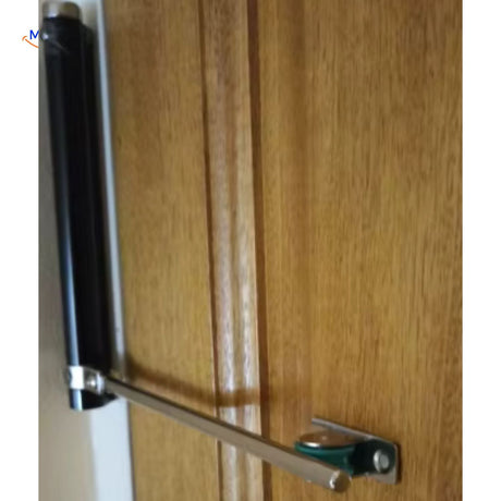 Black hydraulic door closer securely mounted on wooden doors.