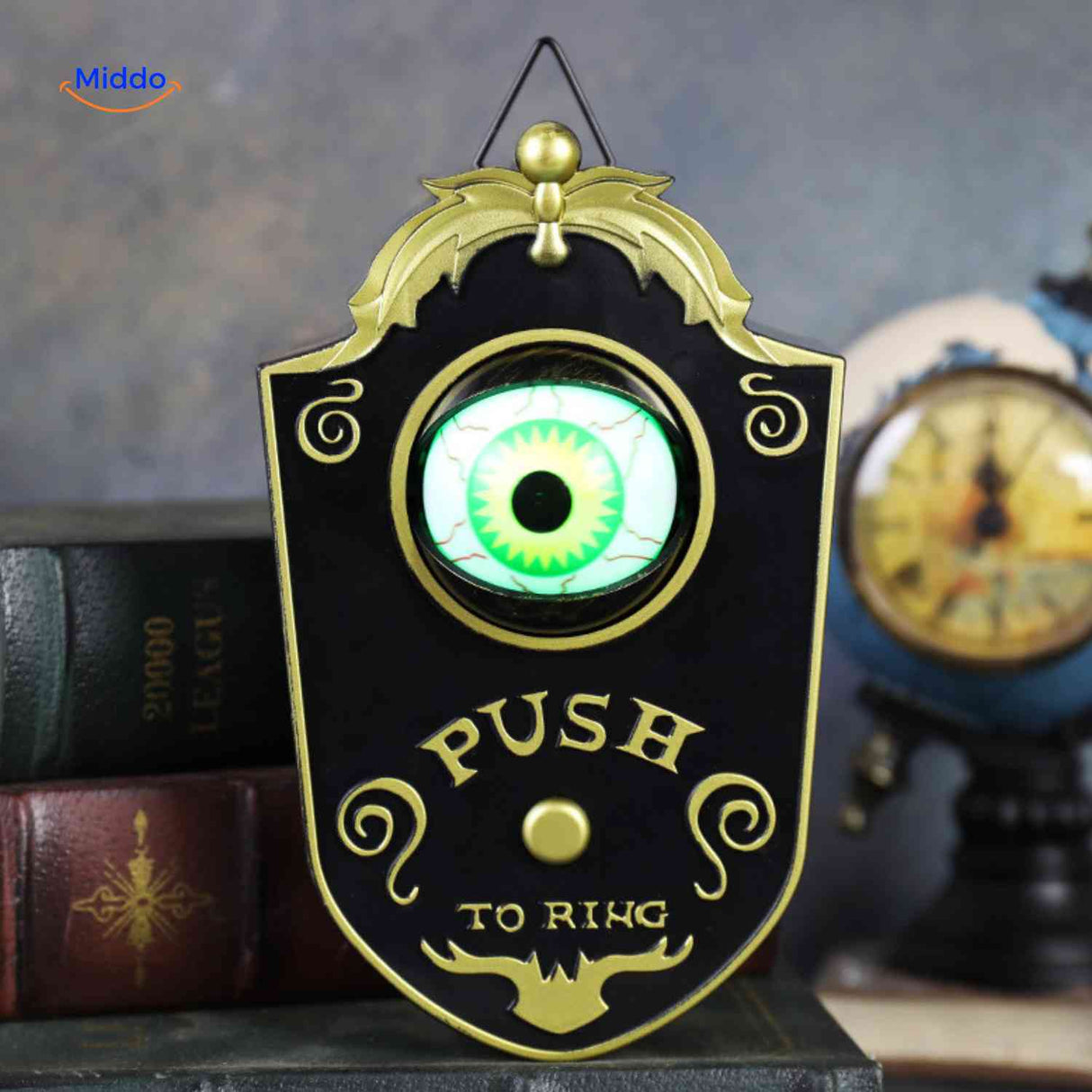 Black Halloween doorbell with bright green glowing eye