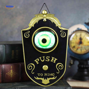 Black Halloween doorbell with bright green glowing eye