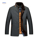 Black quilted jacket with brown trim and warm interior lining.