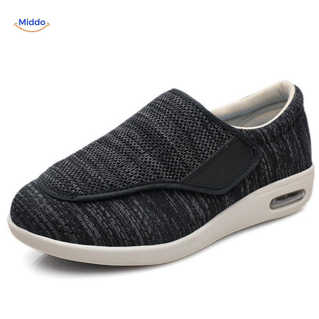 Black comfort shoes with breathable mesh upper and durable rubber sole.