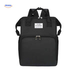 Black modern diaper backpack with sleek design and foldable bassinet feature.
