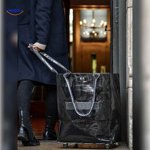 Black foldable shopping trolley with wheels for home and city use