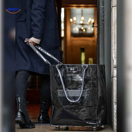 Black foldable shopping trolley with wheels for home and city use