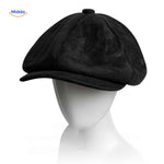 Black suede flat cap combining vintage charm with comfortable wear.