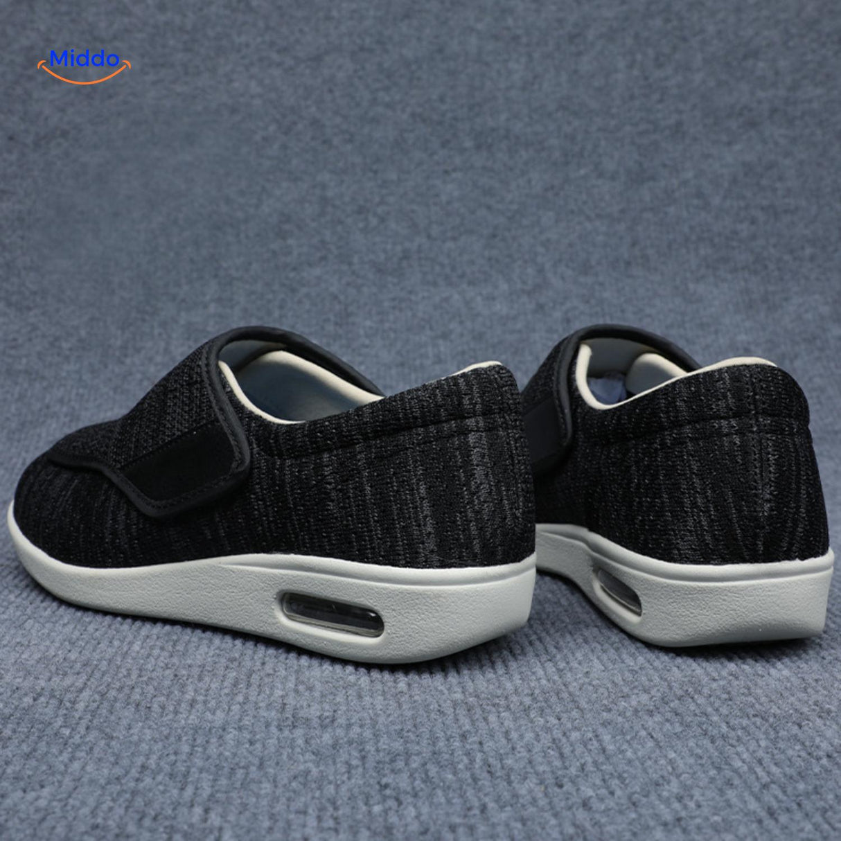 Black support shoes with velcro closure shown from back angle.