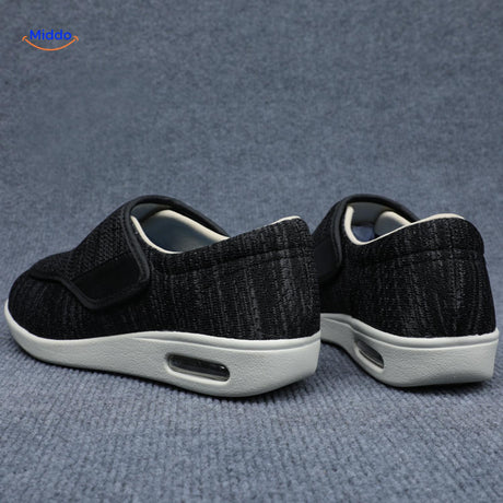 Black support shoes with velcro closure shown from back angle.