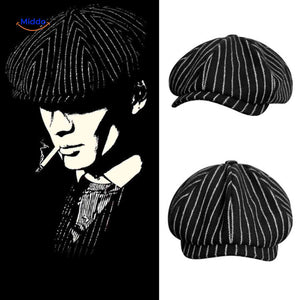 Black and white striped wool newsboy cap with vintage appeal.