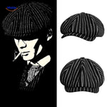 Black and white striped wool newsboy cap with vintage appeal.