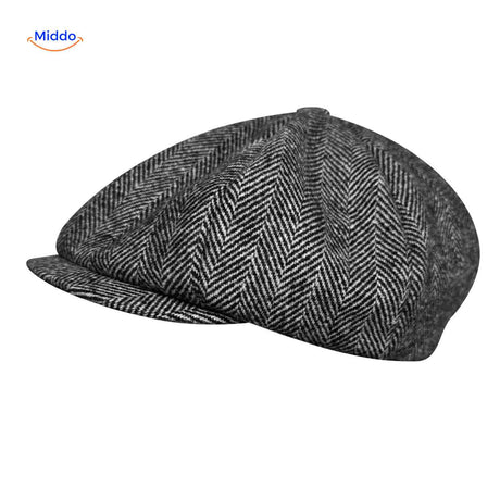 Black wool peaky cap with heritage newsboy style and all-season warmth.
