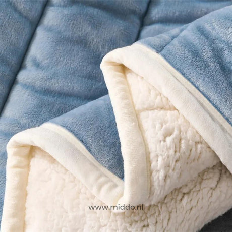 Close-up detail of plush wool blanket fabric texture and softness.