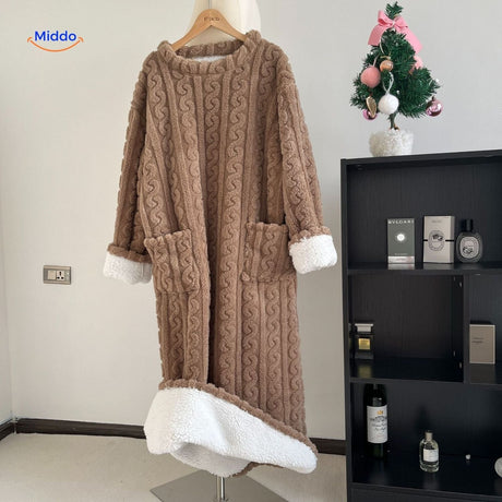 Pastel pink blanket robe offering soft, warm fleece comfort.