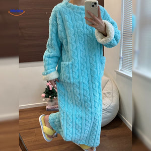 Turquoise Snugglewear robe with white sherpa trim edges.