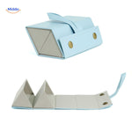 Blue foldable 2-slot eyeglasses case shown closed, highlighting its slim travel-ready profile.