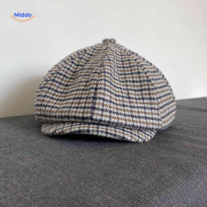 Blue and brown houndstooth wool flat cap with vintage heritage style.