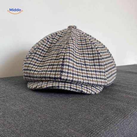 Blue and brown houndstooth wool flat cap with vintage heritage style.