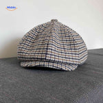 Blue and brown houndstooth wool flat cap with vintage heritage style.