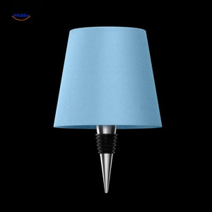 Blue rechargeable dimmable bottle lamp creating cool mood lighting.