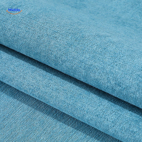 Blue chenille sofa cover close-up, displaying plush texture and water-repellent fabric properties.
