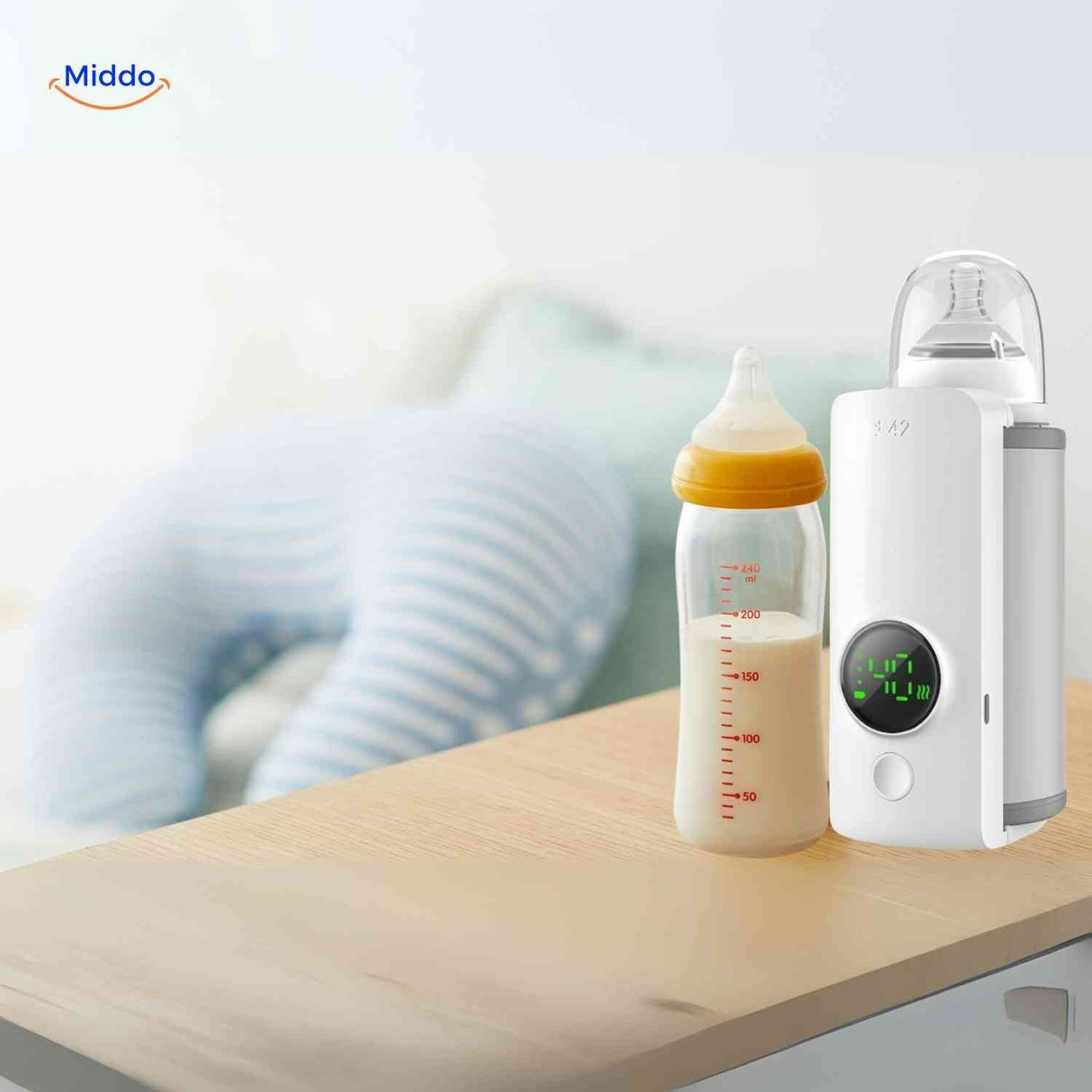 Cordless bottle warmer placed next to a baby bottle on a table, ready to use