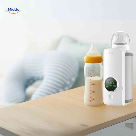 Cordless bottle warmer placed next to a baby bottle on a table, ready to use