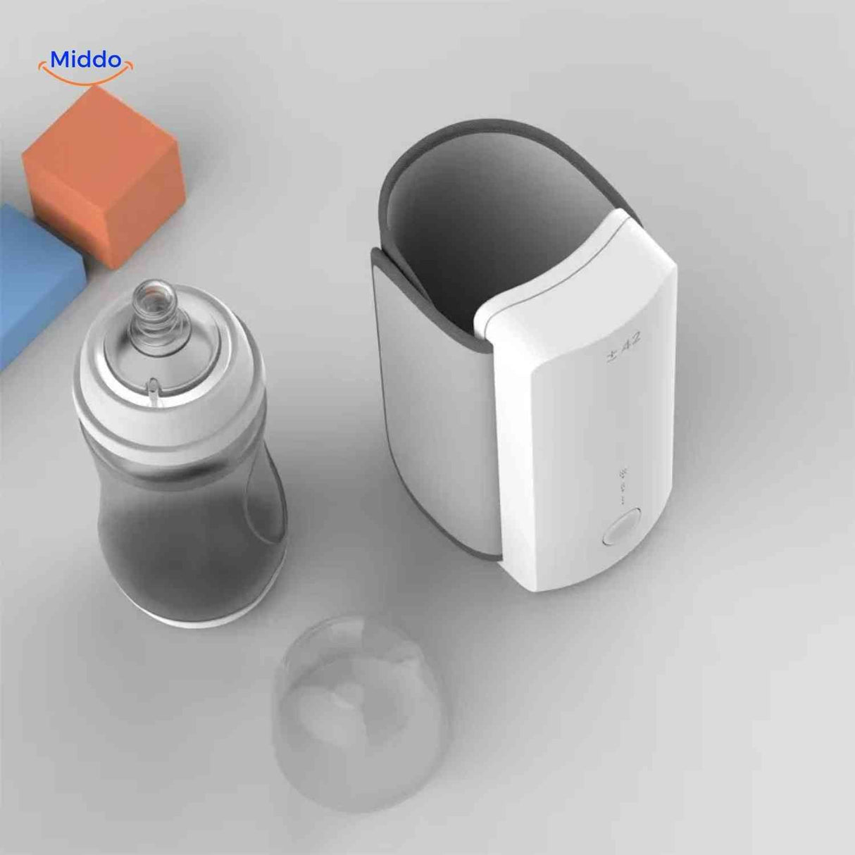 Top-down view of the cordless bottle warmer with a baby bottle inserted inside
