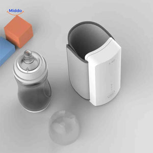 Top-down view of the cordless bottle warmer with a baby bottle inserted inside