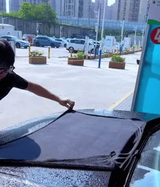 BraidDry car drying towel in action demonstrating fast water absorption.