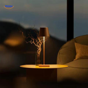 Brown portable LED lamp with cordless design and square base.