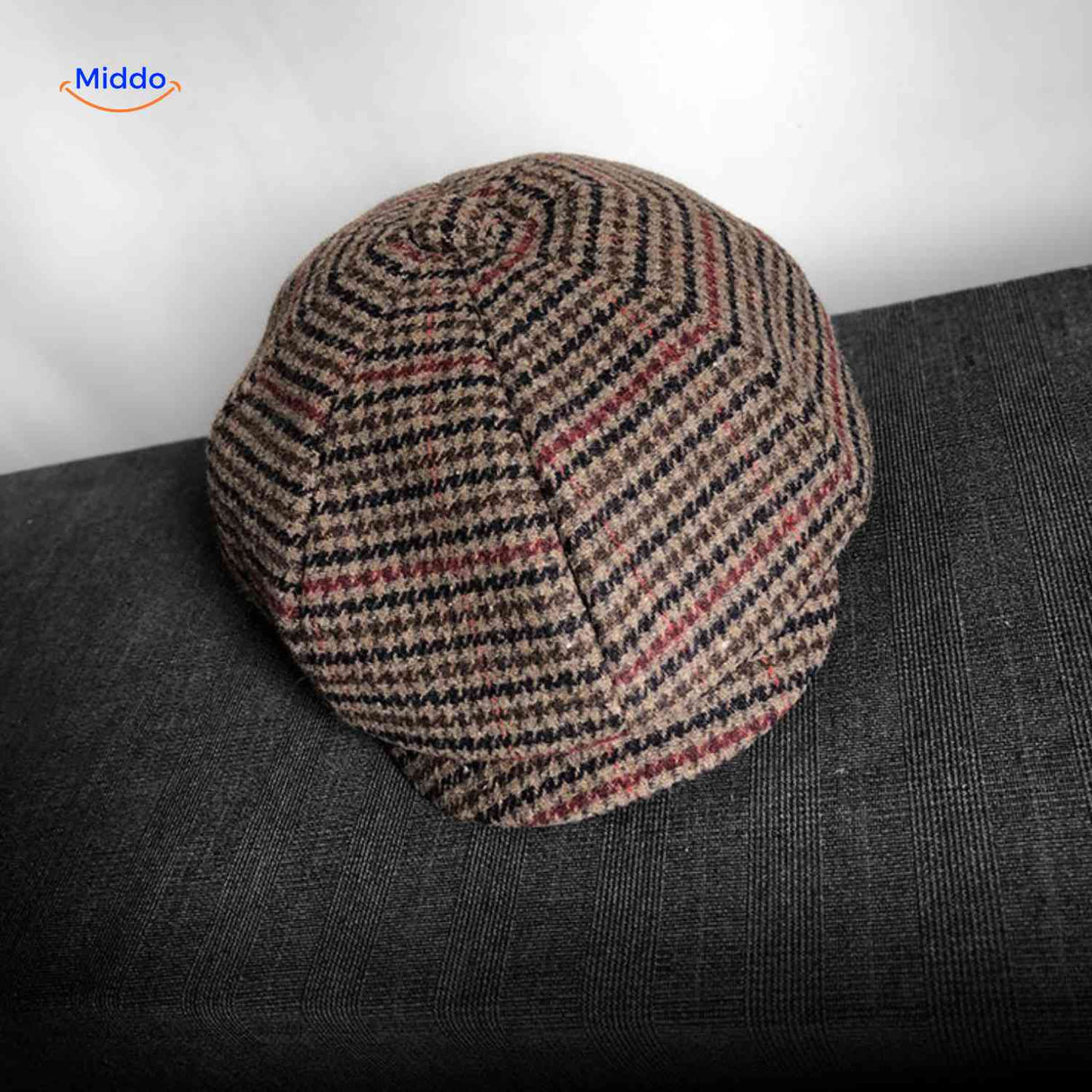 Brown and red plaid wool newsboy cap with classic vintage design.
