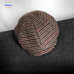 Brown and red plaid wool newsboy cap with classic vintage design.