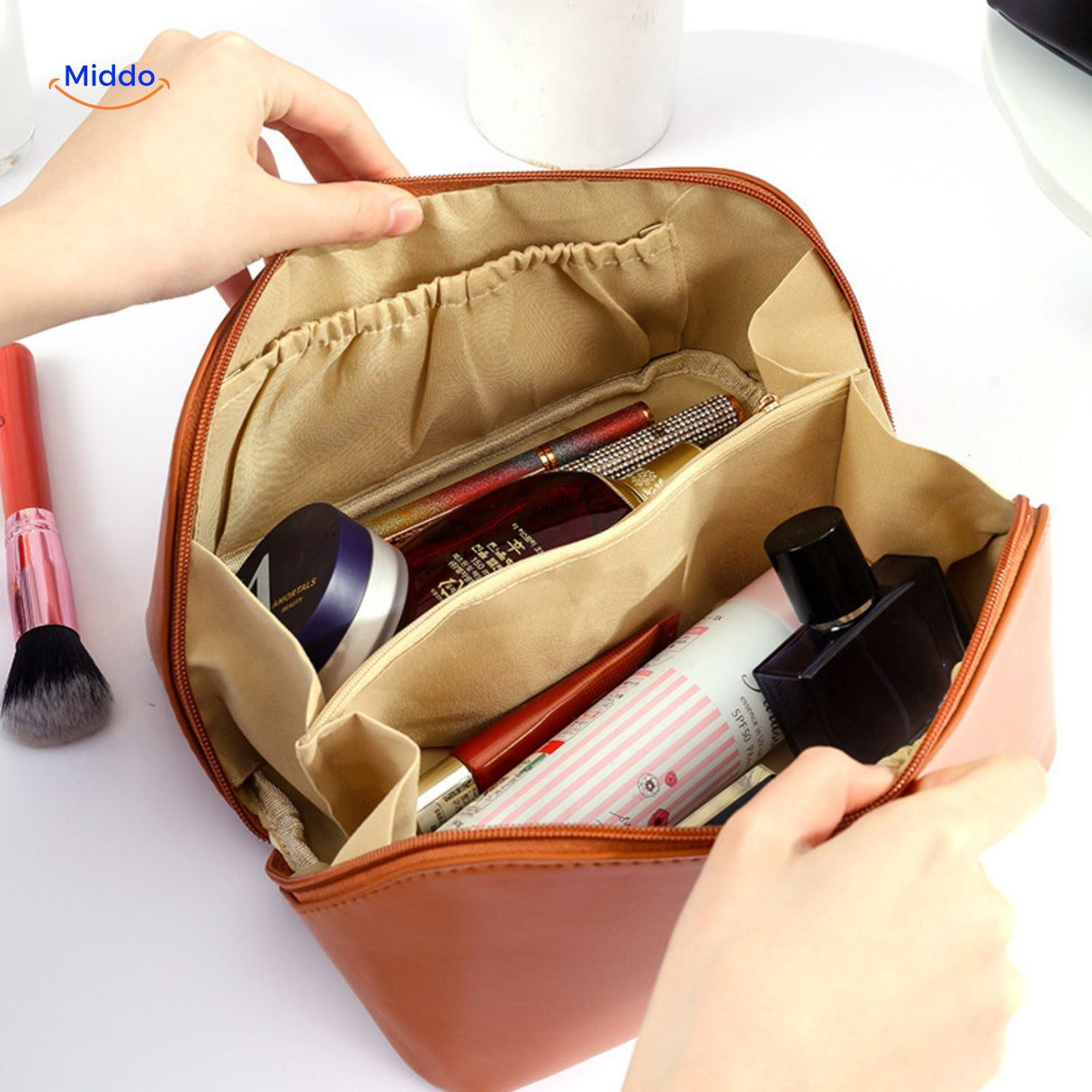 Brown waterproof pouch with packed items inside