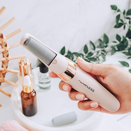 Pedicure PRO electric callus remover applied to feet showing smooth skin