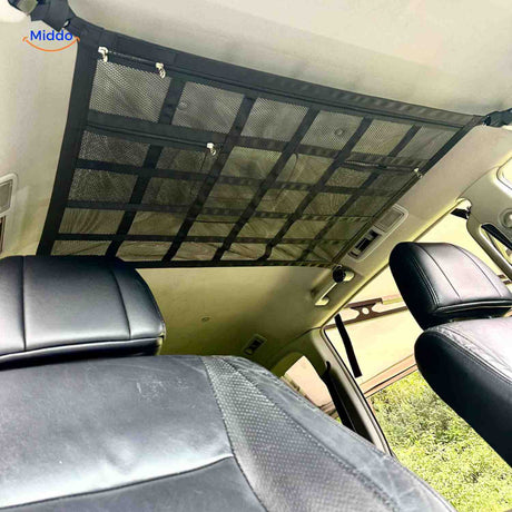 Car roof storage net with secure zipper closure for overhead organization.