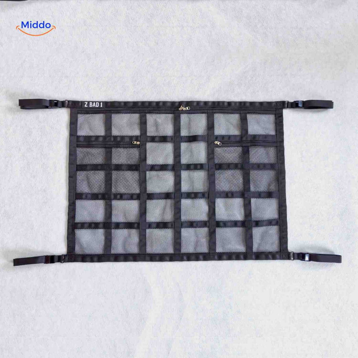 Car storage bag with multiple pockets and universal buckle attachment system.