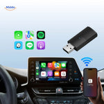 CarLink Pro adapter held in hand, demonstrating its compact and portable wireless design.