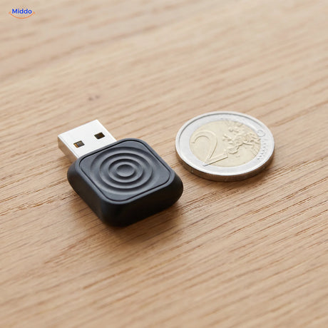 CarLink Pro adapter next to a euro coin, barely larger