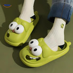 Woman wearing green cartoon dog slippers with cozy comfort design.