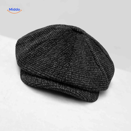 Charcoal houndstooth wool flat cap with timeless vintage appeal.