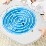 Child playing with blue spiral maze disc on balance board game