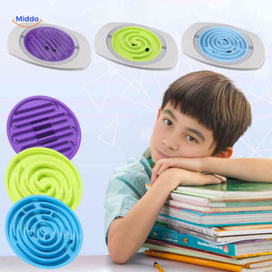 Child concentrating while playing with interchangeable maze discs