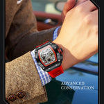 Men's chronograph sport watch with red and black dial on arm.