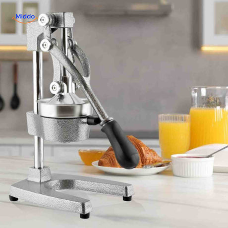 Robust Citripress hand press producing fresh, pulp-free fruit juice.