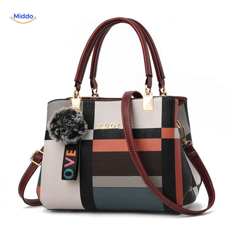 Classic tote handbag with warm fur and neutral color scheme.