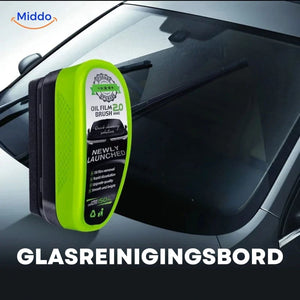 Driver using ClearView sponge to clean car windshield for streak-free results.